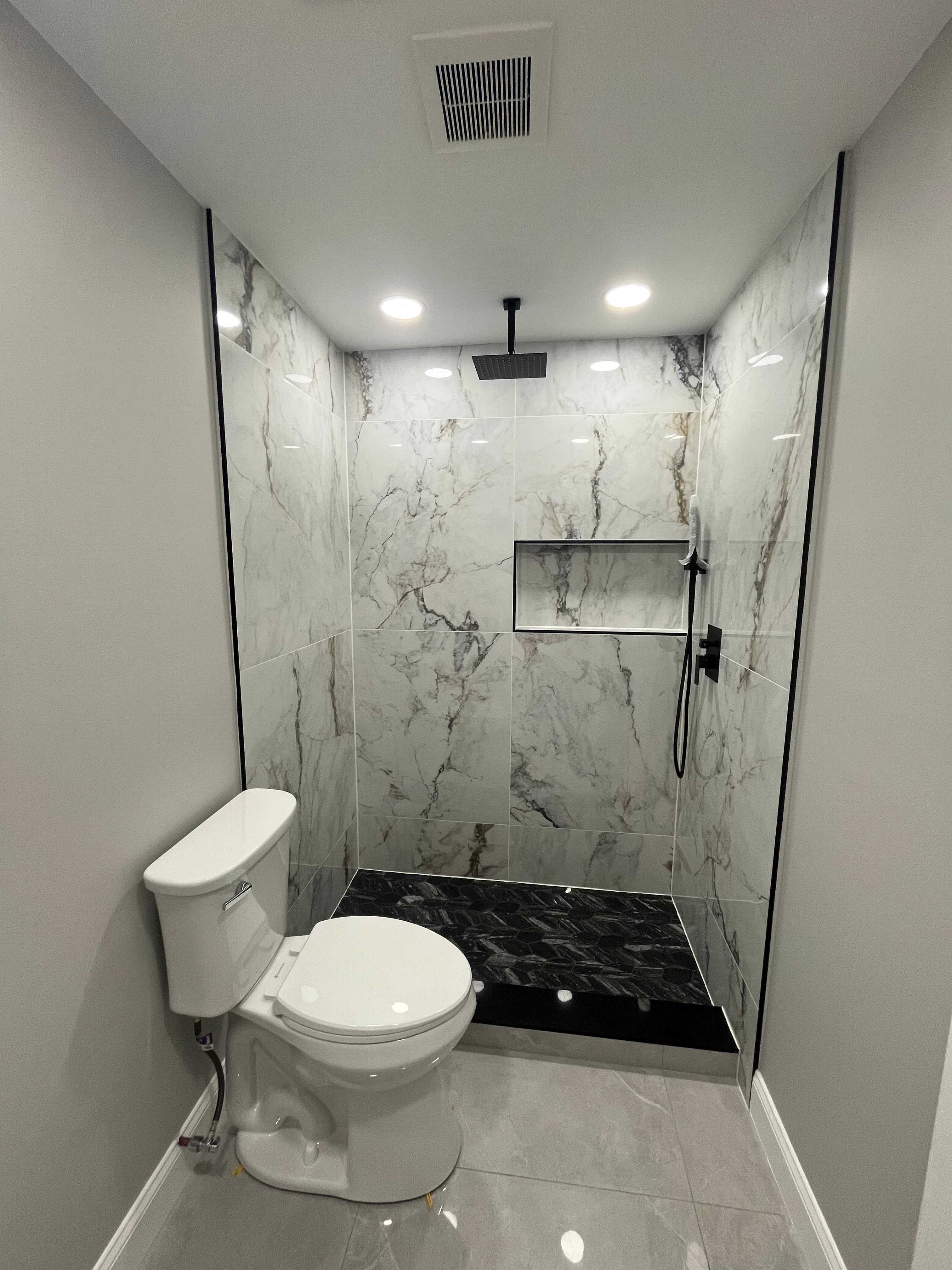 Calacatta Master Bath — Shower wall — book-matched Calacatta marble